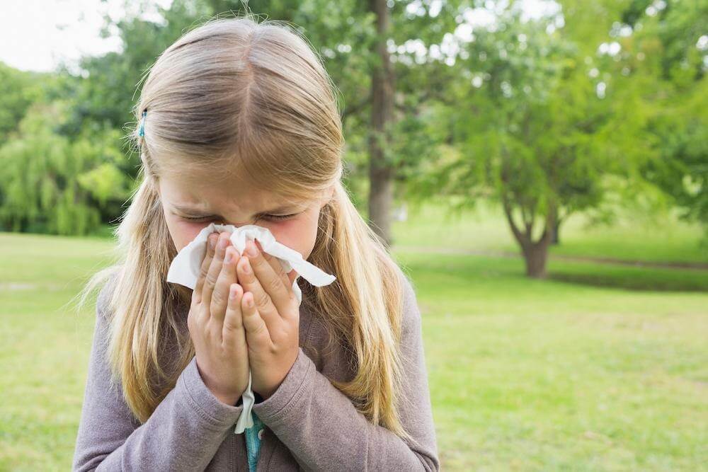 Girl sneezing